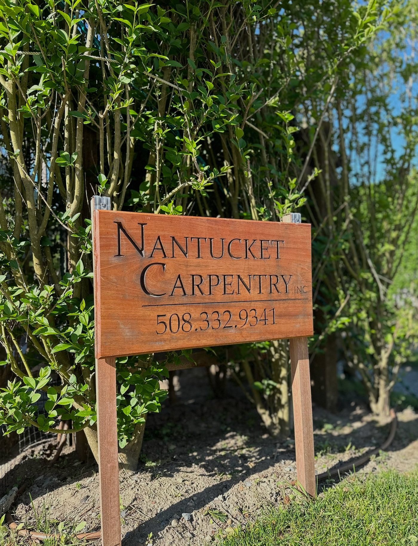Hand-carved Nantucket Carpentry Inc. sign